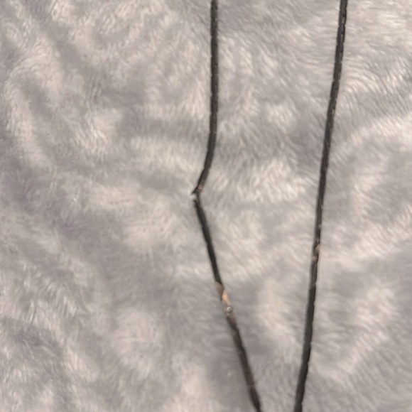 This is a bronze and black looking necklace. - Picture 5 of 5